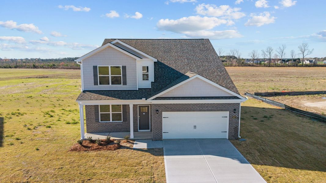 Front exterior of a new home in Beaver Dam Crossing, Bailey, NC, highlighting curb appeal (Image 21). Front exterior of a new home in Beaver Dam Crossing, Bailey, NC, highlighting curb appeal (Image 21).
