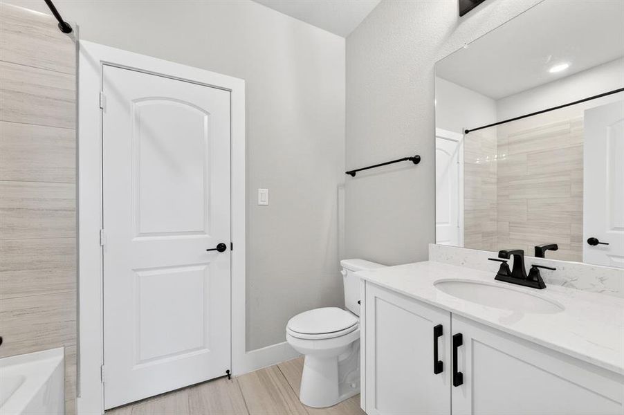 Furnished interior view inside a new home in Light Farms Graham/Reagan, Celina (Image 14).