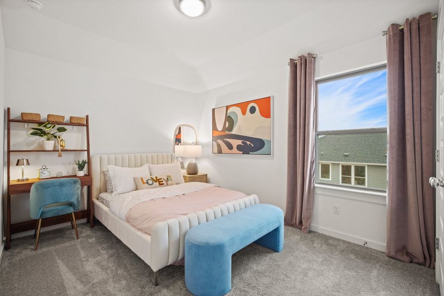 Bedroom in a Trinity Ranch Oak Model home in Elgin TX by Trophy Signature Homes