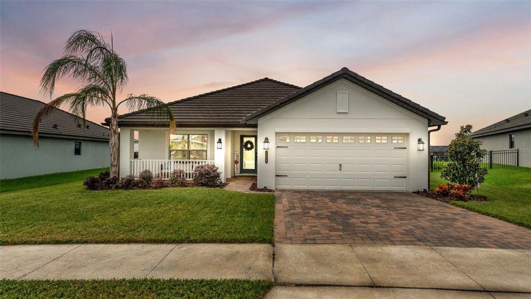 Front exterior of a new home in Lake Juliana Estates, Auburndale, FL, highlighting curb appeal (Image 1). Front exterior of a new home in Lake Juliana Estates, Auburndale, FL, highlighting curb appeal (Image 1).