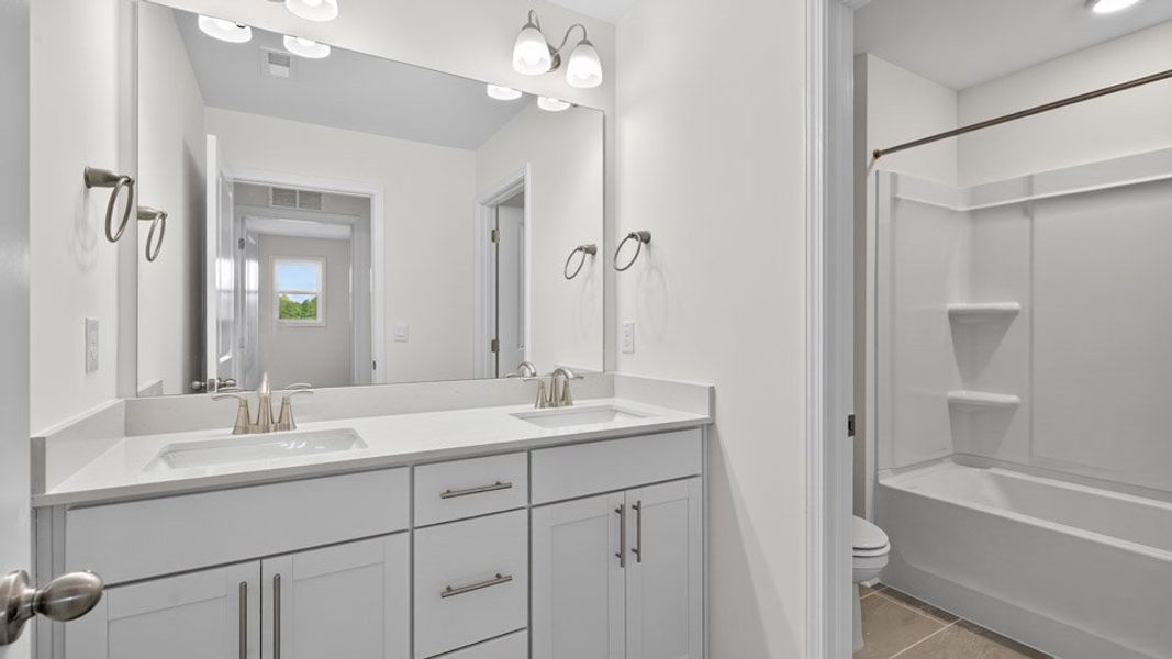 Representative furnished interior of a home built from the Wylie by D.R. Horton in Kalas Falls, Wake Forest (Image 10).