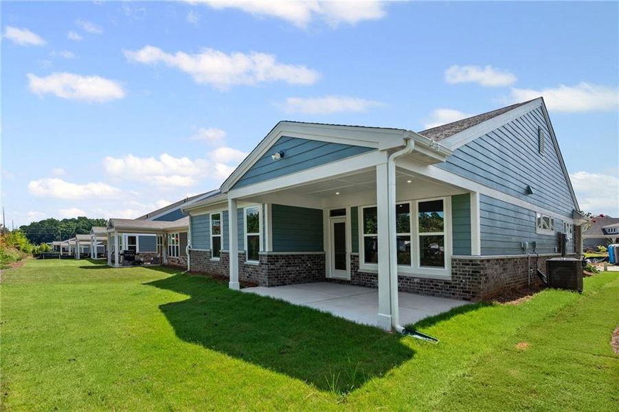 Front exterior of a new home in Laurel Farms, Dallas, GA, highlighting curb appeal (Image 19).