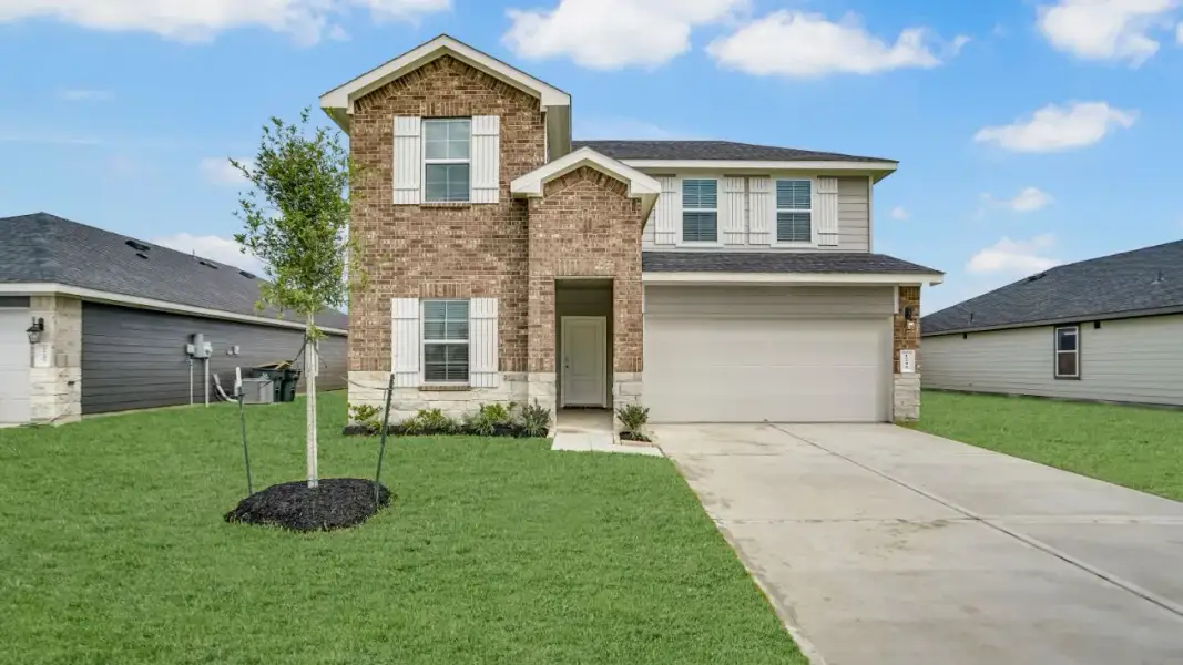 Front exterior of a new home in Westward Pointe, Sealy, TX, highlighting curb appeal (Image 1). Front exterior of a new home in Westward Pointe, Sealy, TX, highlighting curb appeal (Image 1).