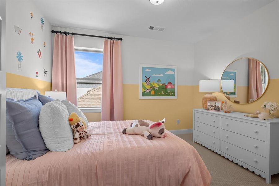 Bedroom with light carpet and baseboards