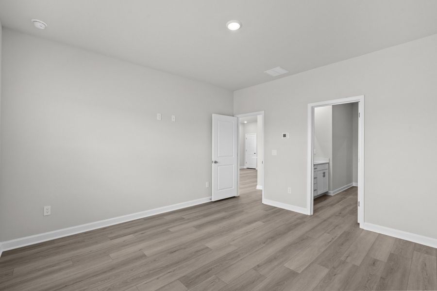 Spacious, unfurnished interior of a new home in Cypress Ridge - The Boardwalk Series, Longs (Image 23).