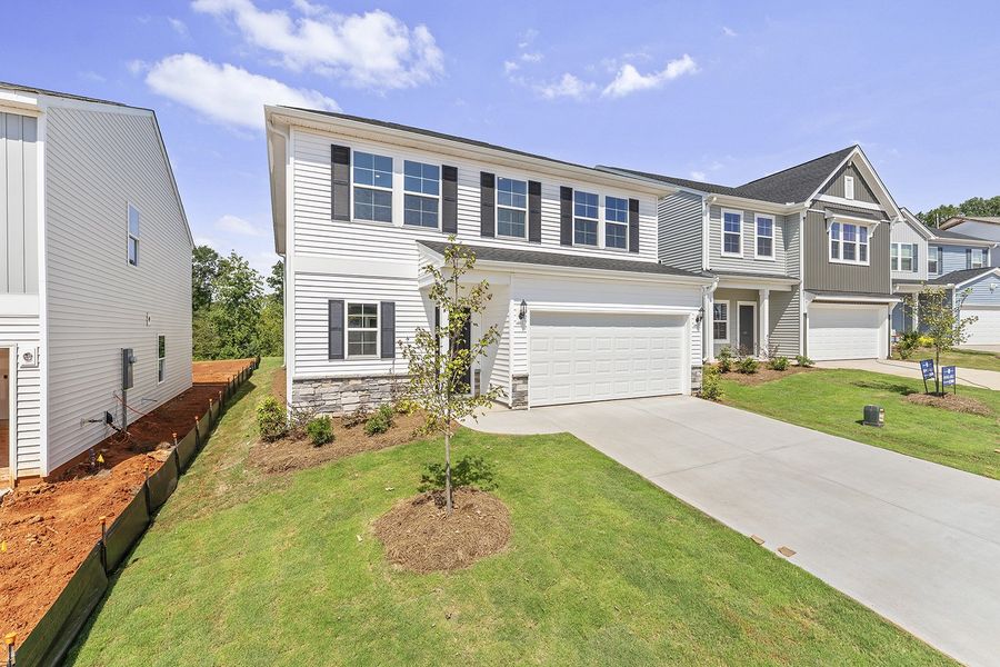 Front exterior of a new home in Mayfair Village, Spartanburg, SC, highlighting curb appeal (Image 16).