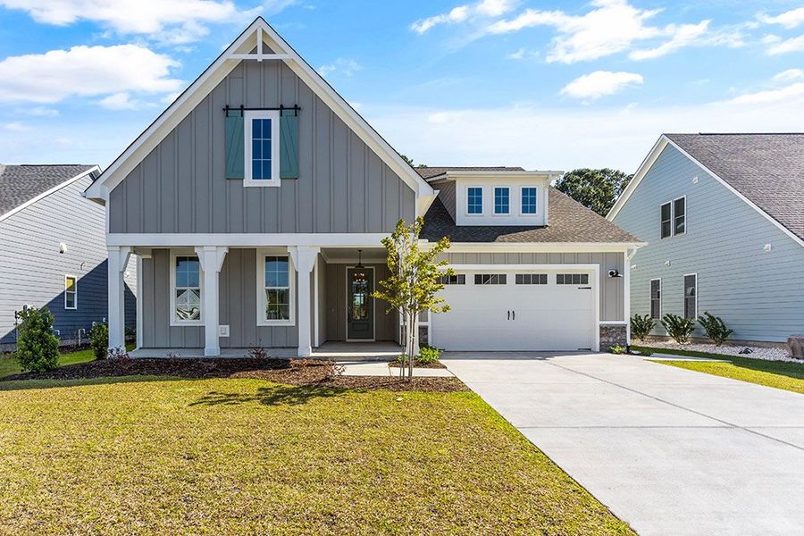 Representative exterior photo of a completed home built from the The Sutton by RobuckHomes in Windwater, Hampstead, NC (Image 11). Representative exterior photo of a completed home built from the The Sutton by RobuckHomes in Windwater, Hampstead, NC (Image 11).