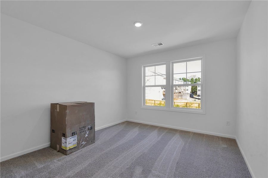 This airy room features ample natural light and pl