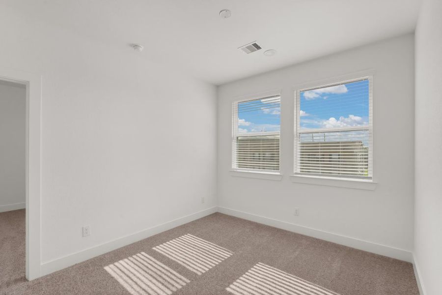Representative unfurnished interior of a home built from the Cheverny by Chesmar Homes in Sienna Chateau, Missouri City (Image 19).