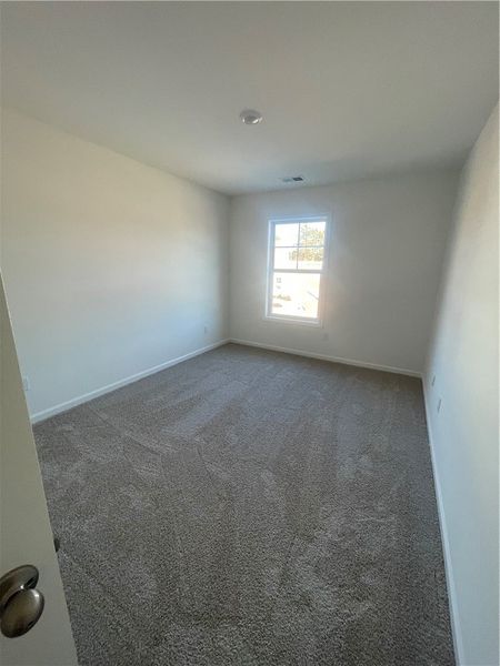 Spacious, unfurnished interior of a new home in Springwood Grove, Central (Image 12).