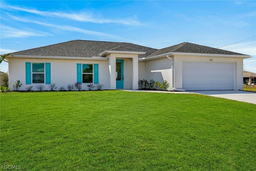 Front exterior of a new home in Cape Coral, Cape Coral, FL, highlighting curb appeal (Image 2). Front exterior of a new home in Cape Coral, Cape Coral, FL, highlighting curb appeal (Image 2).