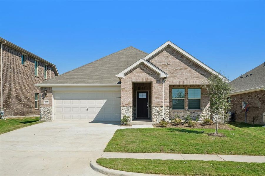 Front exterior of a new home in Stonehaven, Seagoville, TX, highlighting curb appeal (Image 1). Front exterior of a new home in Stonehaven, Seagoville, TX, highlighting curb appeal (Image 1).
