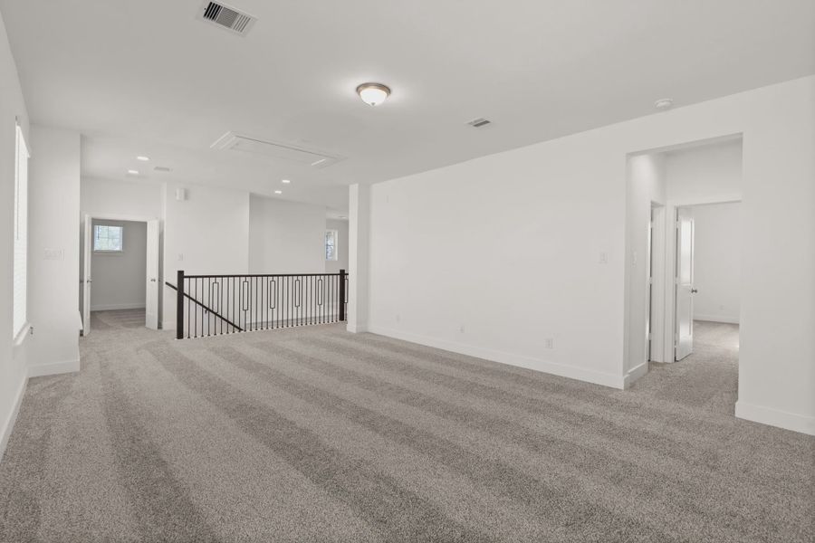 Representative unfurnished interior of a home built from the Macalister by Chesmar Homes in Artavia, Conroe (Image 12).
