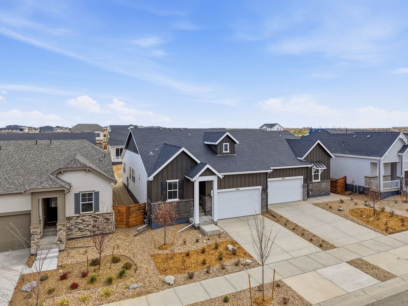 Front exterior of a new home in The Aurora Highlands, Aurora, CO, highlighting curb appeal (Image 16).