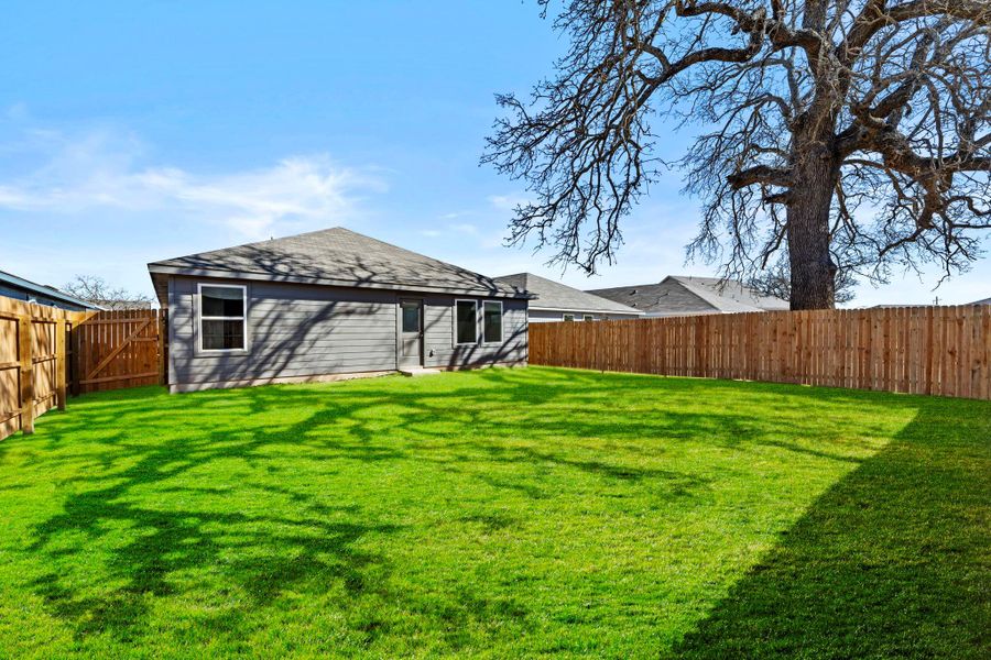 Exterior details and patio area of a home in Friendship Oaks, Fredericksburg (Image 2).