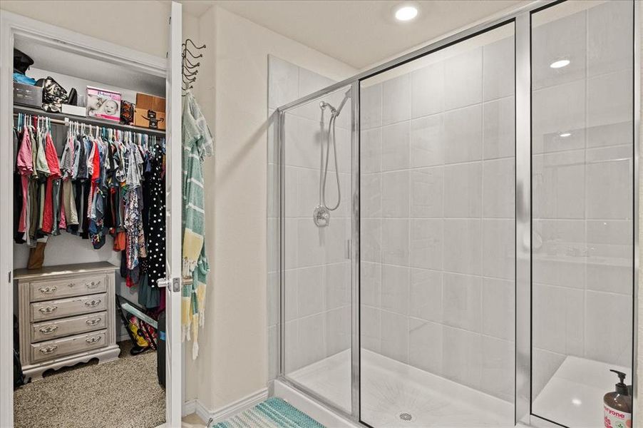 Bathroom featuring a shower with shower door