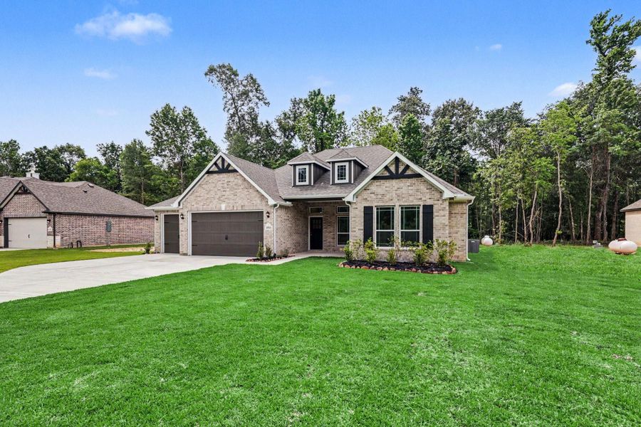 Front exterior of a new home in Encino Estates, Dayton, TX, highlighting curb appeal (Image 18).