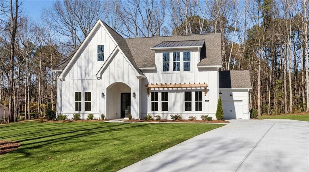 Front exterior of a new home in , Gainesville, GA, highlighting curb appeal (Image 2). Front exterior of a new home in , Gainesville, GA, highlighting curb appeal (Image 2).