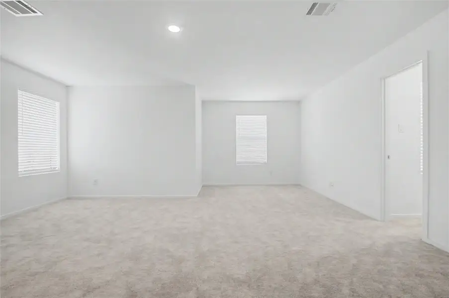 Spacious, unfurnished interior of a new home in Sunterra, Katy (Image 22).