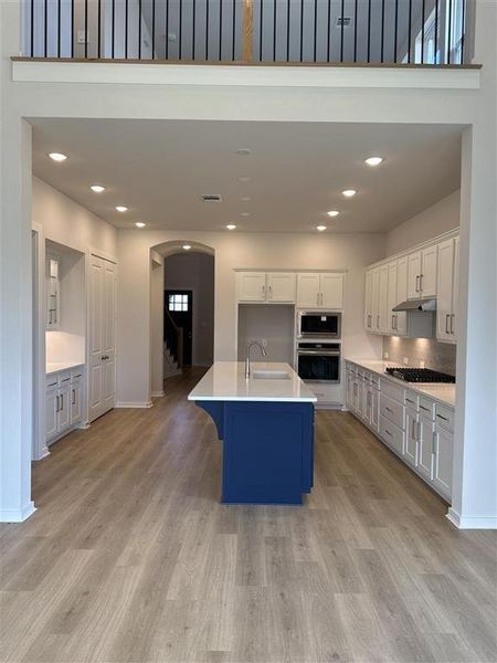 Kitchen with a hutch that has glass inserts and puck lights!