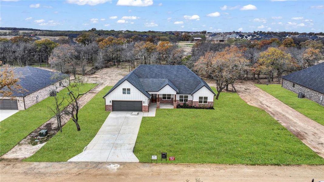 Front exterior of a new home in , Millsap, TX, highlighting curb appeal (Image 21).