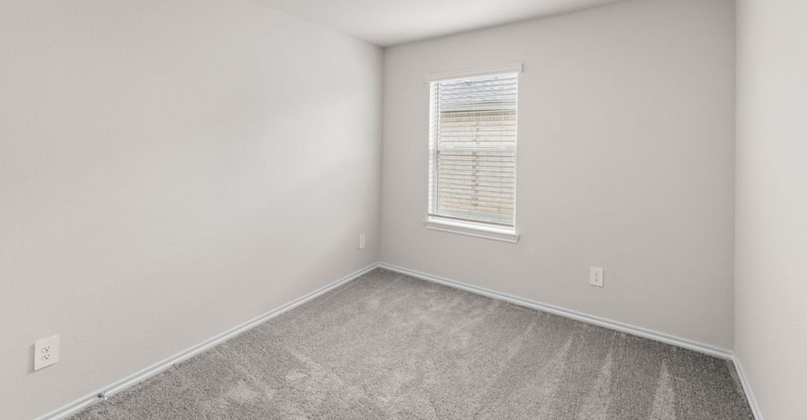 Representative exterior photo of a completed home built from the Austin by Impression Homes in Keeneland, Aubrey, TX (Image 20).