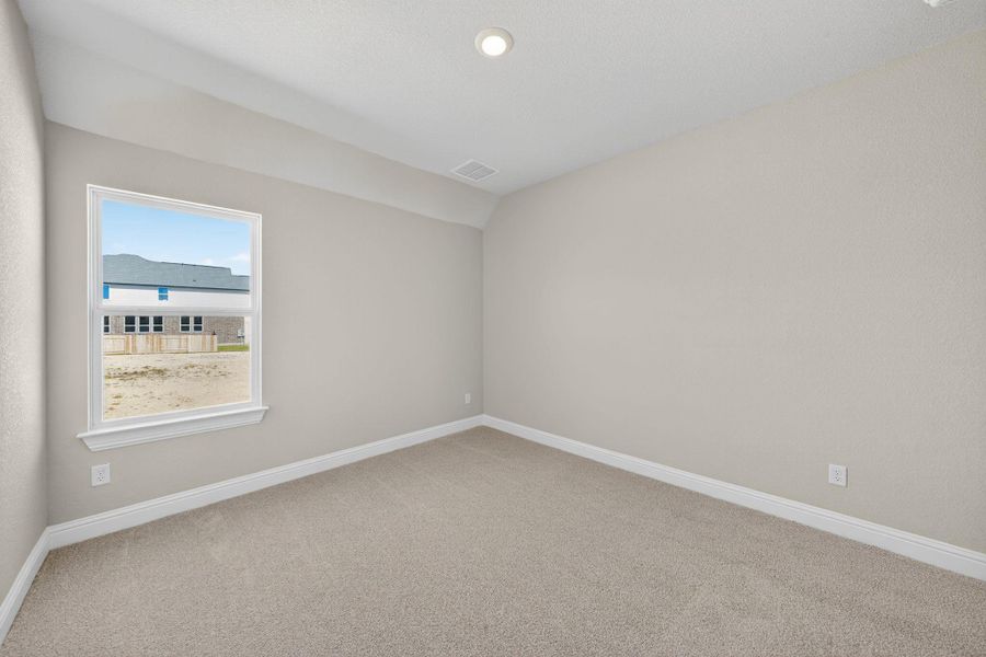 Spare room featuring light colored carpet, recessed lighting, and lofted ceiling Spare room featuring light colored carpet, recessed lighting, and lofted ceiling