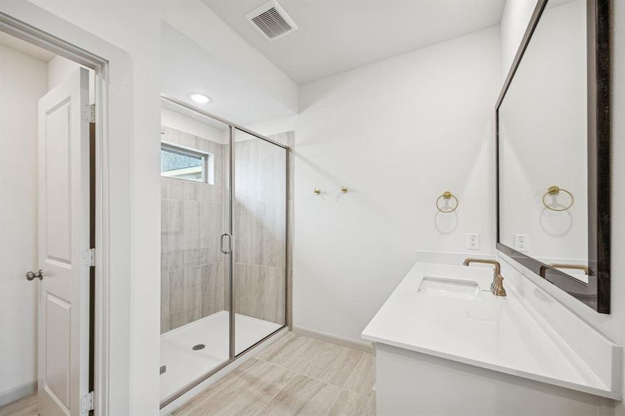 You'll enjoy the oversized walk in shower in this owner's bath.