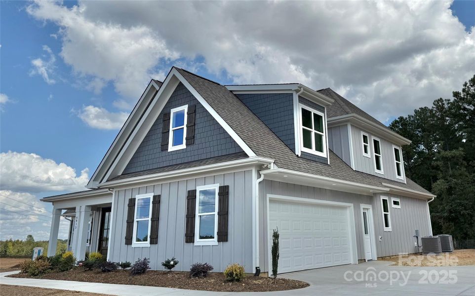 Front exterior of a new home in , Waxhaw, NC, highlighting curb appeal (Image 23).