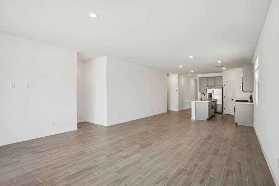 Great room and kitchen. Finishes and options may vary by community