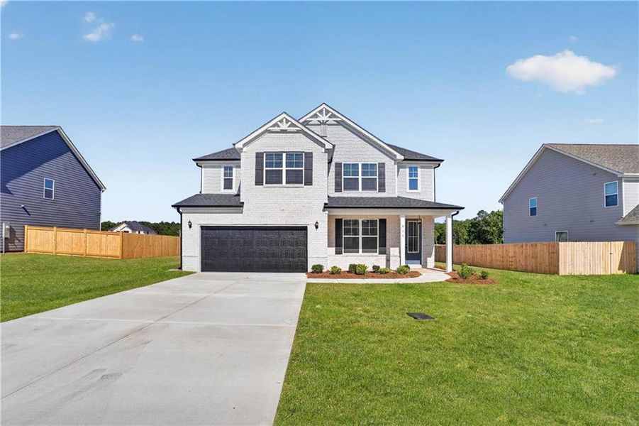 Front exterior of a new home in , Bonaire, GA, highlighting curb appeal (Image 1). Front exterior of a new home in , Bonaire, GA, highlighting curb appeal (Image 1).