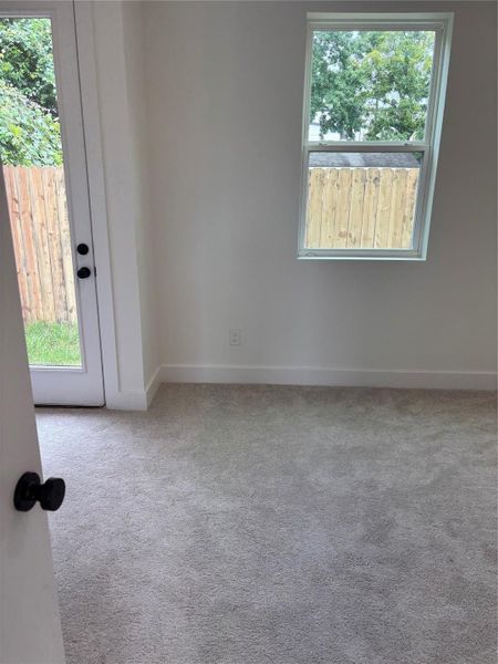 1st Floor bedroom with backdoor access and full bath