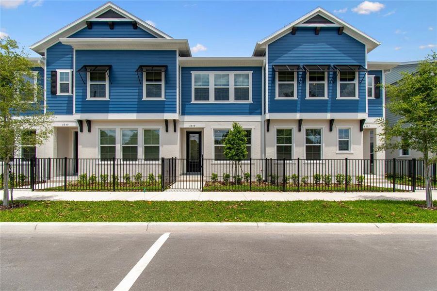 Front exterior of a new home in , Orlando, FL, highlighting curb appeal (Image 22).