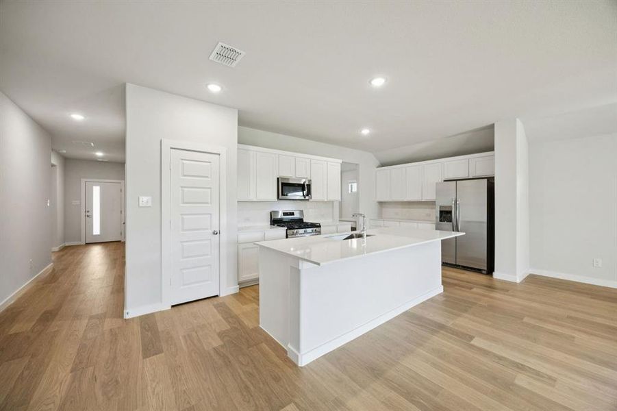 Kitchen in the Heisman home plan by Trophy Signature Homes – REPRESENTATIVE PHOTO Kitchen in the Heisman home plan by Trophy Signature Homes – REPRESENTATIVE PHOTO