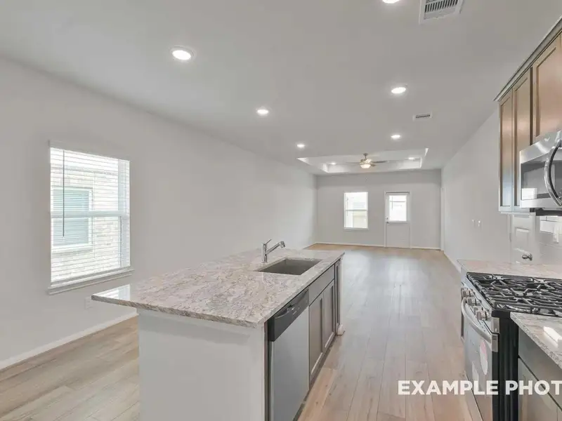 Furnished interior view inside a new home in Caney Creek Place, Conroe (Image 8).