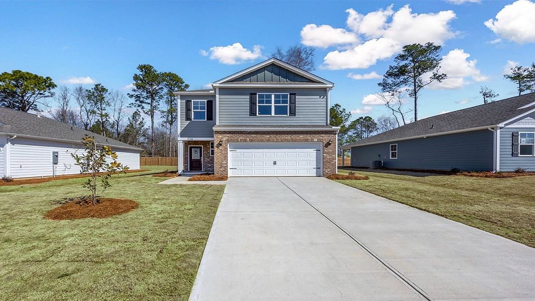 Front exterior of a new home in Sease's Pond, Gilbert, SC, highlighting curb appeal (Image 19).