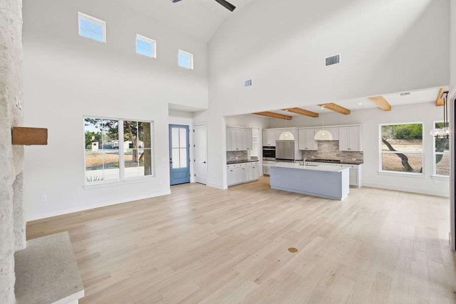 Light filled family room with clerestory windows opening to kitchen