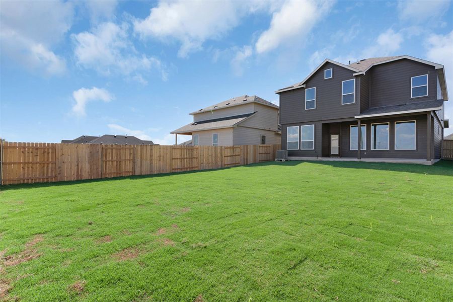 Rear view of house with a fenced backyard, a patio, and roof with shingles Rear view of house with a fenced backyard, a patio, and roof with shingles