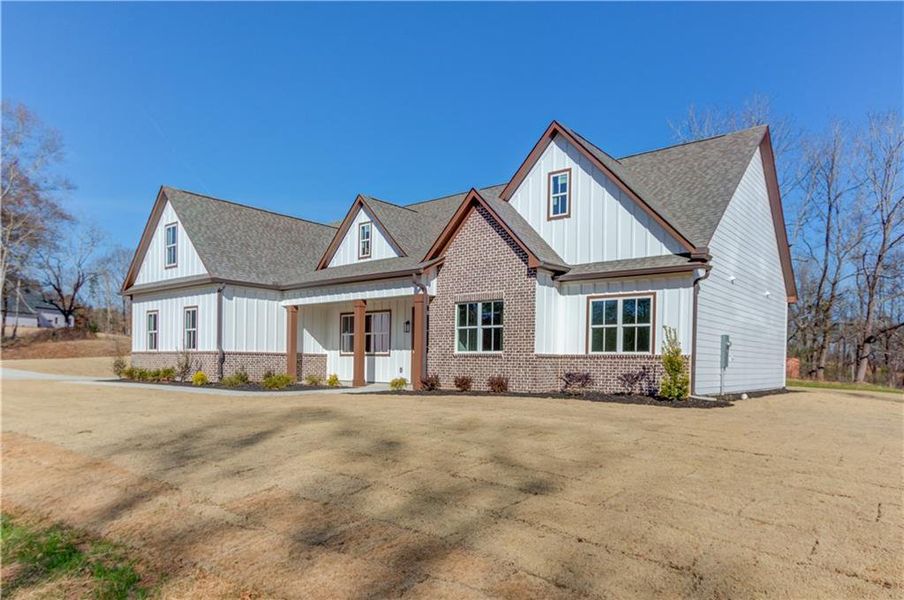 Front exterior of a new home in , Jefferson, GA, highlighting curb appeal (Image 28).