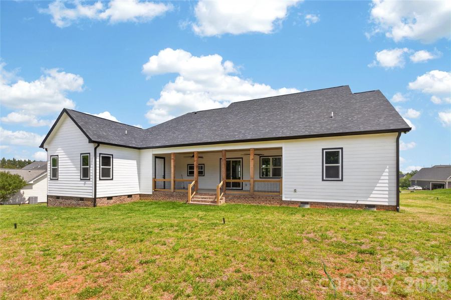 The backyard setup everyone wants — a large covered porch, plenty of yard space, and room to create the outdoor living area you’ve always talked about