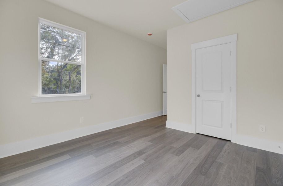 Spacious, unfurnished interior of a new home in Indigo Grove Single Family Homes, Johns Island (Image 39).