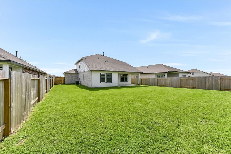 Front exterior of a new home in River Ranch Meadows, Dayton, TX, highlighting curb appeal (Image 22).
