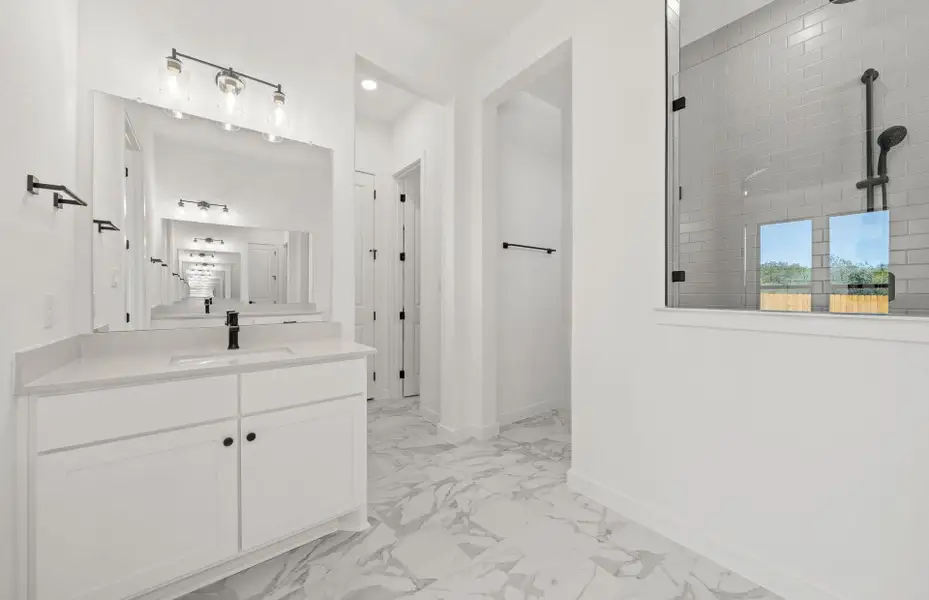 Furnished interior view inside a new home in 6 Creeks, Kyle (Image 9).