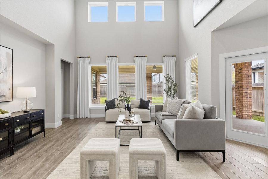 Tall windows and elevated transom glass bring the outdoors in, providing exceptional natural light while highlighting the home's impressive architectural design.
