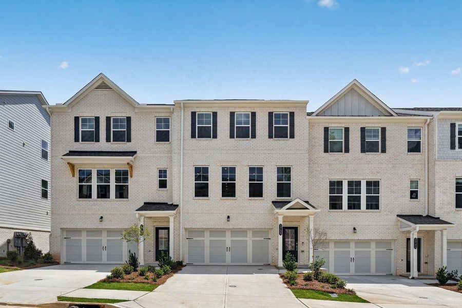 Front exterior of a new home in Somerset at Veterans Memorial, Mableton, GA, highlighting curb appeal (Image 2). Front exterior of a new home in Somerset at Veterans Memorial, Mableton, GA, highlighting curb appeal (Image 2).