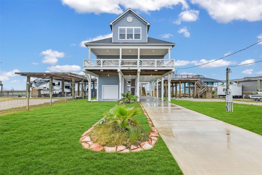 This stunning canal front home features a classic design with a spacious front and rear balcony overlooking Christmas Bay. Ideal for coastal living. This stunning canal front home features a classic design with a spacious front and rear balcony overlooking Christmas Bay. Ideal for coastal living.