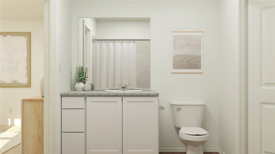 Bathroom featuring toilet and vanity