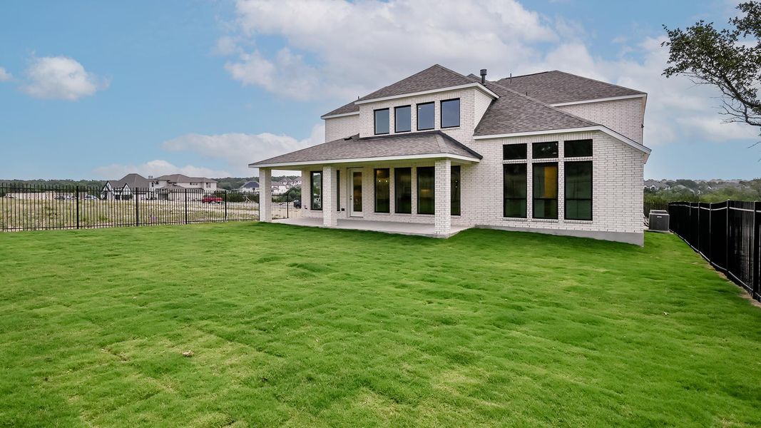 Rear view of house featuring a shingled roof, a patio, central air condition unit, and brick siding Rear view of house featuring a shingled roof, a patio, central air condition unit, and brick siding