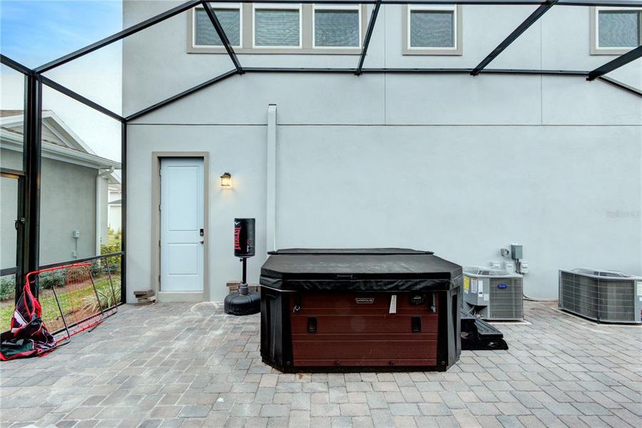 hot tub in screened back patio