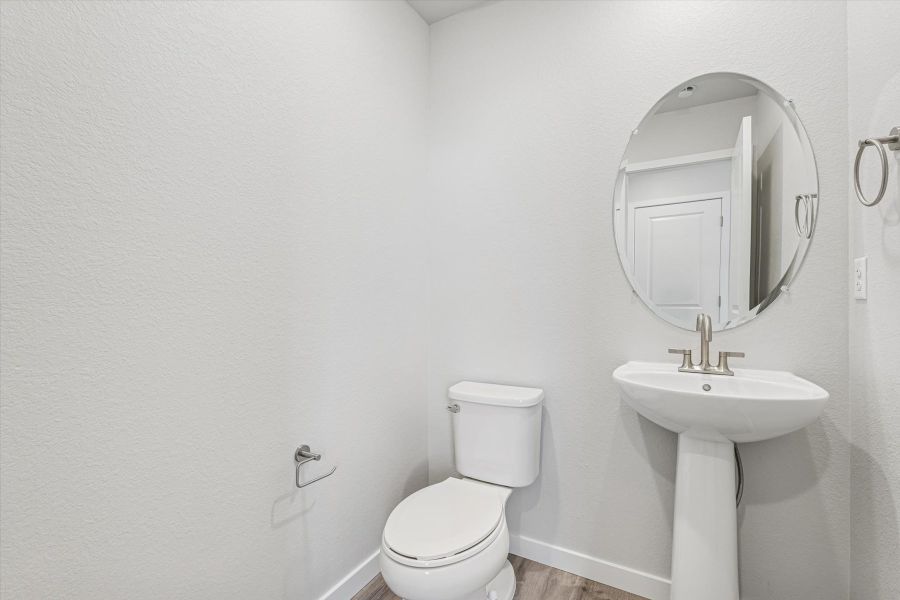A bathroom with a sink and toilet.